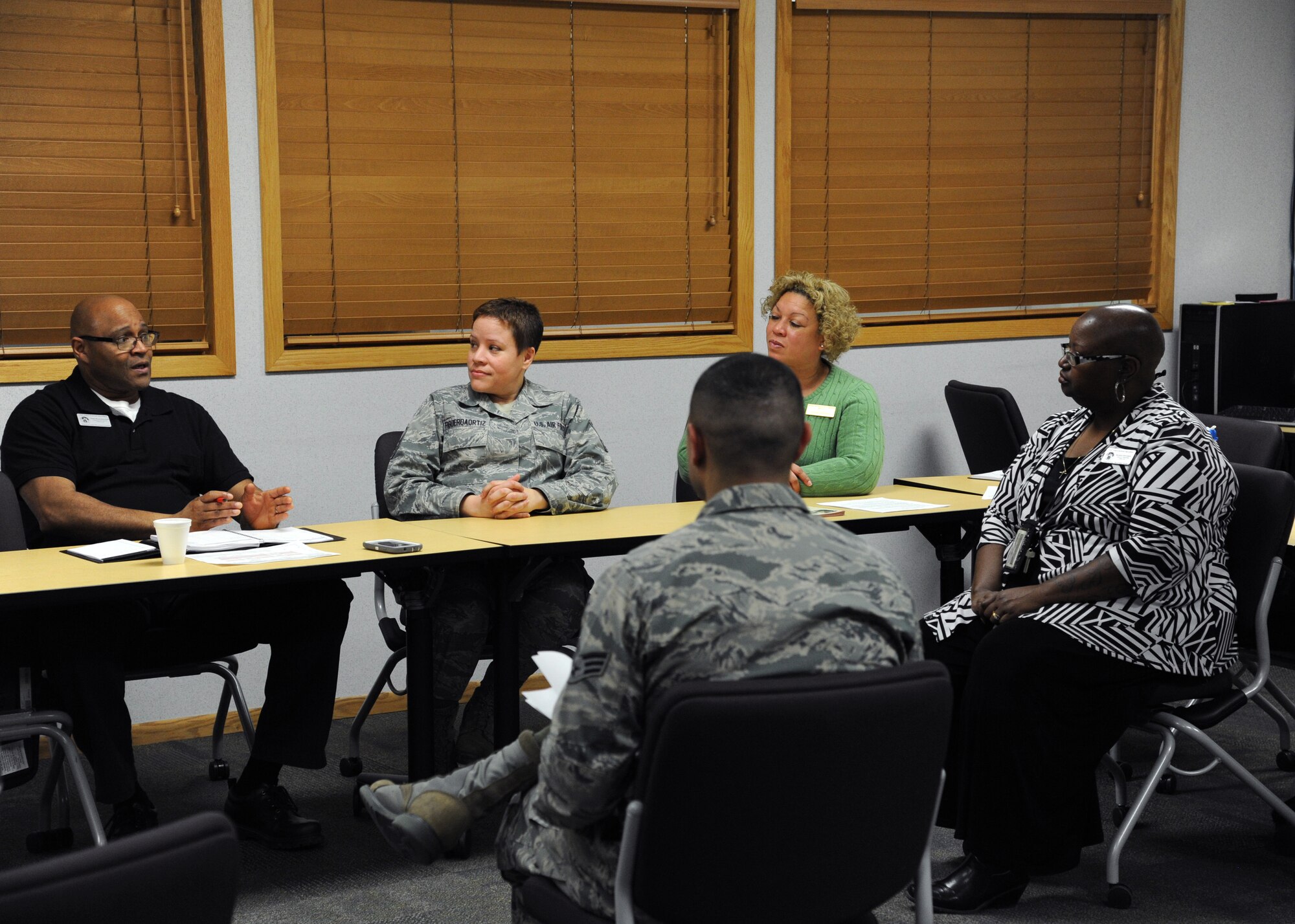 Warriors of the North discuss money and marriage Feb. 2, 2016, on Grand Forks Air Force Base, N.D. The Airman & Family Readiness Center hosted the first of six classes during Military Saves Month. Each class covers several different financial topics and help to inform Airmen about different services provided on base. (U.S. Air Force photo by Airman 1st Class Ryan Sparks/Released)