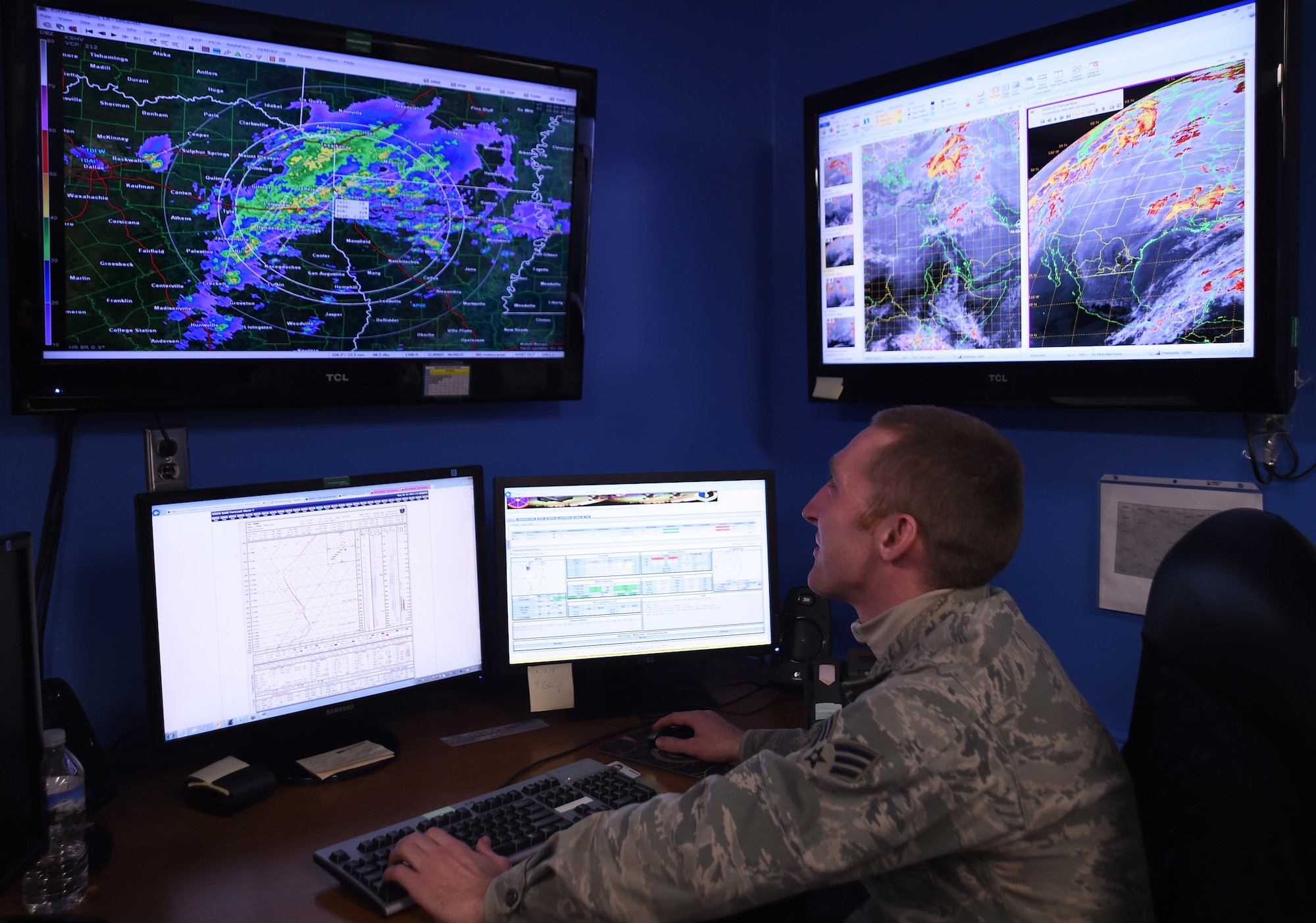 Senior Airman James Fauth, 319th Operations Support Squadron Weather Flight weather forecaster, demonstrates how the satellite and radar imaging work for tracking weather on Grand Forks Air Force Base, North Dakota, Jan. 21, 2016. The weather flight use the imaging to track weather occurring in the local area and in areas where missions are taking place. (U.S. Air Force photo by Senior Airman Bonnie Grantham/released)