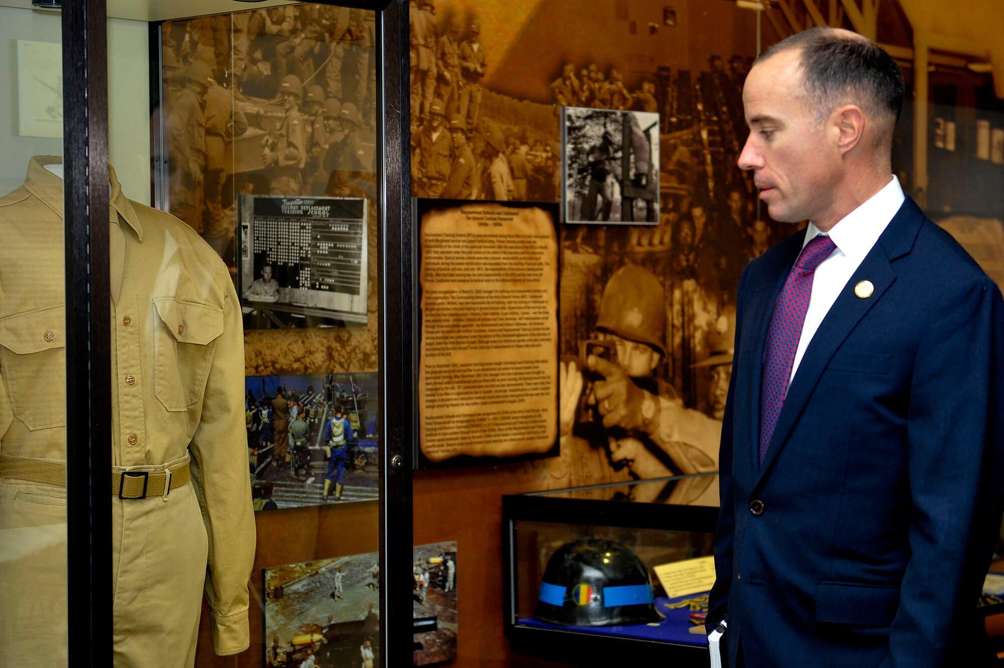 Charles Bowery, Jr., the new U.S. Army Chief of Military History, looks at the uniform of one of the founders of the U.S. Army Training and Doctrine Command during a tour of the U.S. Army Transportation Museum at Fort Eustis, Va., Jan. 27, 2016. The transportation museum is one of 57 active Army museums across the world, which Bowery oversees. (U.S. Air Force photo by Senior Airman Breonna Veal)  