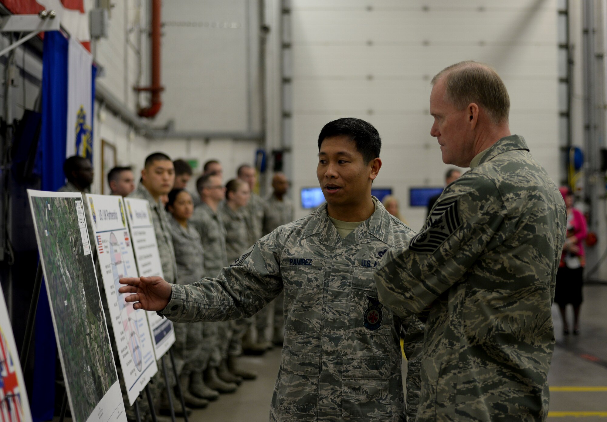 U.S. Air Force Master Sgt. Jason Ramirez, 100th Civil Engineer Squadron assistant chief of operations, briefs Chief Master Sgt. of the Air Force James Cody Jan. 28, 2016, on RAF Mildenhall, England. Ramirez briefed Cody on the F-18 Hornet mishap that happened in 2015 and met with members of the response team. (U.S. Air Force photo by Senior Airman Victoria H. Taylor/Released)