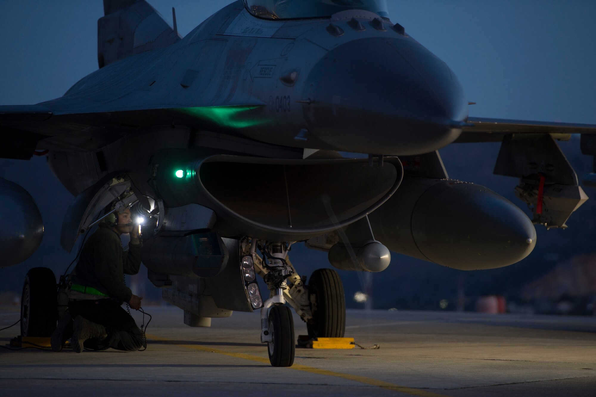 A U.S. Air Force crew chief assigned to the 480th Expeditionary Fighter Squadron performs pre-flight checks on an F-16 Fighting Falcon fighter aircraft before departure during a flying training deployment at Souda Bay, Greece, Feb. 1. 2016. Approximately 300 personnel and 18 F-16s from the 52nd Fighter Wing at Spangdahlem Air Base, Germany, will support the FTD as part of U.S. Air Forces in Europe-Air Forces Africa's Forward Ready Now stance. (U.S. Air Force photo by Staff Sgt. Christopher Ruano/Released)