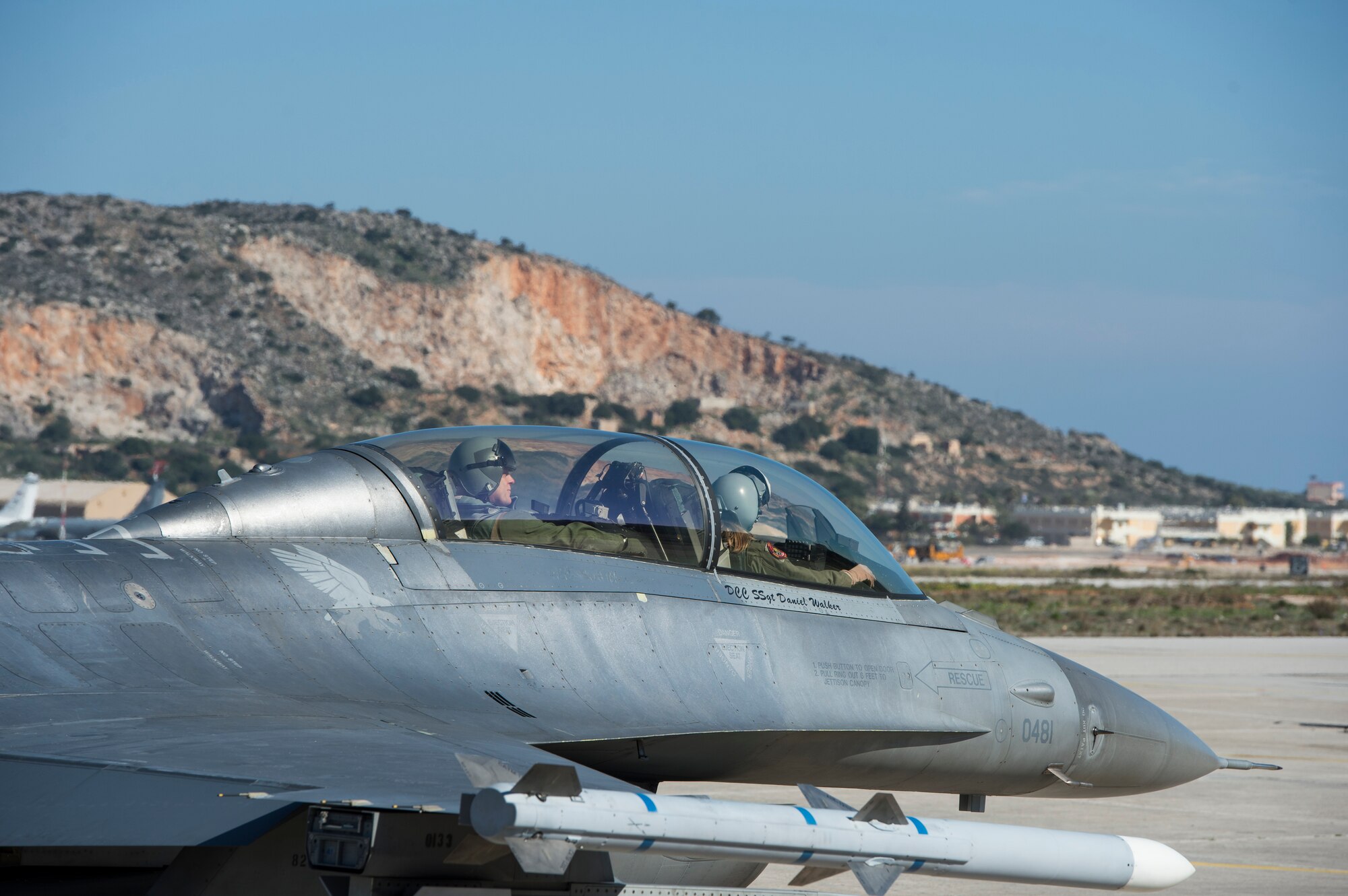A U.S. Air Force F-16 Fighting Falcon fighter aircraft pilot assigned to the 480th Expeditionary Fighter Squadron carrying U.S. Air Forces in Europe and Air Forces Africa commander Gen. Frank Gorenc, taxi down the flightline during a training mission at Souda Bay, Greece, Feb. 1. 2016.  Gorenc took to the skies with the 480th EFS to experience firsthand the flying training deployment being conducted with the Hellenic air forces. (U.S. Air Force photo by Staff Sgt. Christopher Ruano/Released)