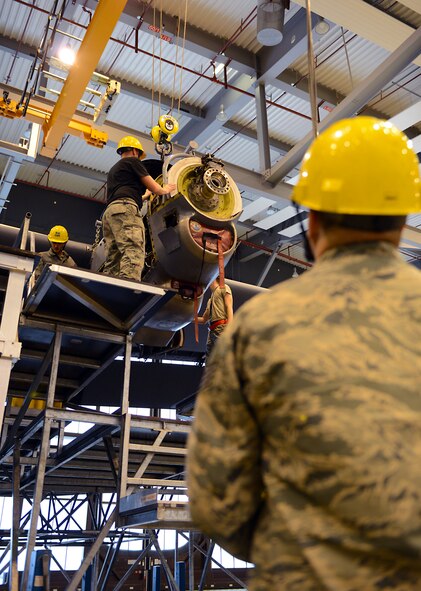 Aerospace propulsion Airmen from the 86th Maintenance Squadron remove an engine from a C-130J Super Hercules during an isochronal (ISO) inspection Jan. 15, 2016, at Ramstein Air Base, Germany. The aircraft was in a C-2 ISO inspection, which is the most in-depth maintenance inspection. (U.S. Air Force photo/Staff Sgt. Timothy Moore)