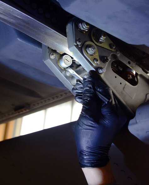 Airman 1st Class Ryan Kuiper, 86th Maintenance Squadron crew chief, applies a lubricant to bearings under the wing of a C-130J Super Hercules Jan. 13, 2016, at Ramstein Air Base, Germany. The lubricant was applied during the “fix-it” phase of a C-2 isochronal inspection. During the approximately two-week long inspection, maintenance personnel perform all kinds of maintenance from replacing lights to repairing wings. (U.S. Air Force photo/Staff Sgt. Timothy Moore)