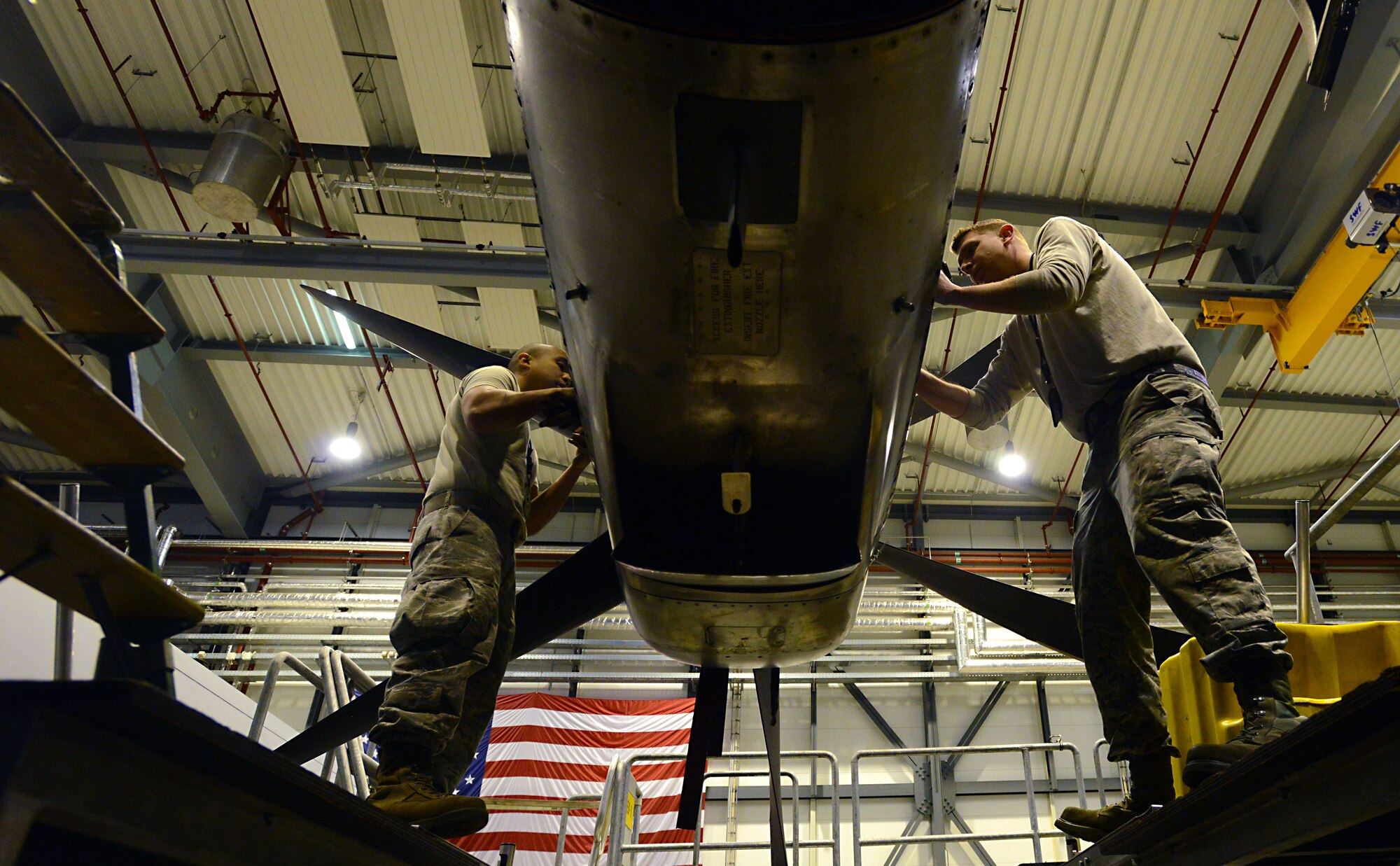 Staff Sgt. Jonathan Deguzman, left, and Staff Sgt. Joshua Stites, both 86th Maintenance Squadron aerospace propulsion journeymen, inspect an engine on a C-130J Super Hercules during a C-2 isochronal (ISO) inspection Jan. 7, 2016, at Ramstein Air Base, Germany. During a C-2 ISO inspection, the aircraft is thoroughly inspected so maintenance personnel can perform both preventive and required maintenance to prolong the lifespan of the aircraft. The inspection can last approximately two weeks. (U.S. Air Force photo/Staff Sgt. Timothy Moore)