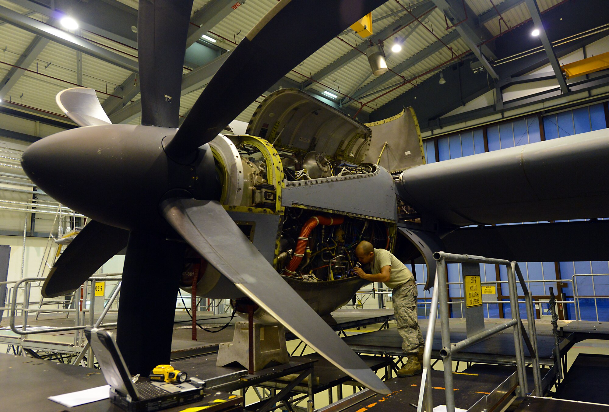 Staff Sgt. Jonathan Deguzman, 86th Maintenance Squadron aerospace propulsion journeyman, inspects an engine on a C-130J Super Hercules Jan. 7, 2016, at Ramstein Air Base, Germany. Deguzman and other Airmen from the 86th MXS Isochronal (ISO) Inspection section performed a C-2 ISO inspection on the aircraft. (U.S. Air Force photo/Staff Sgt. Timothy Moore) 