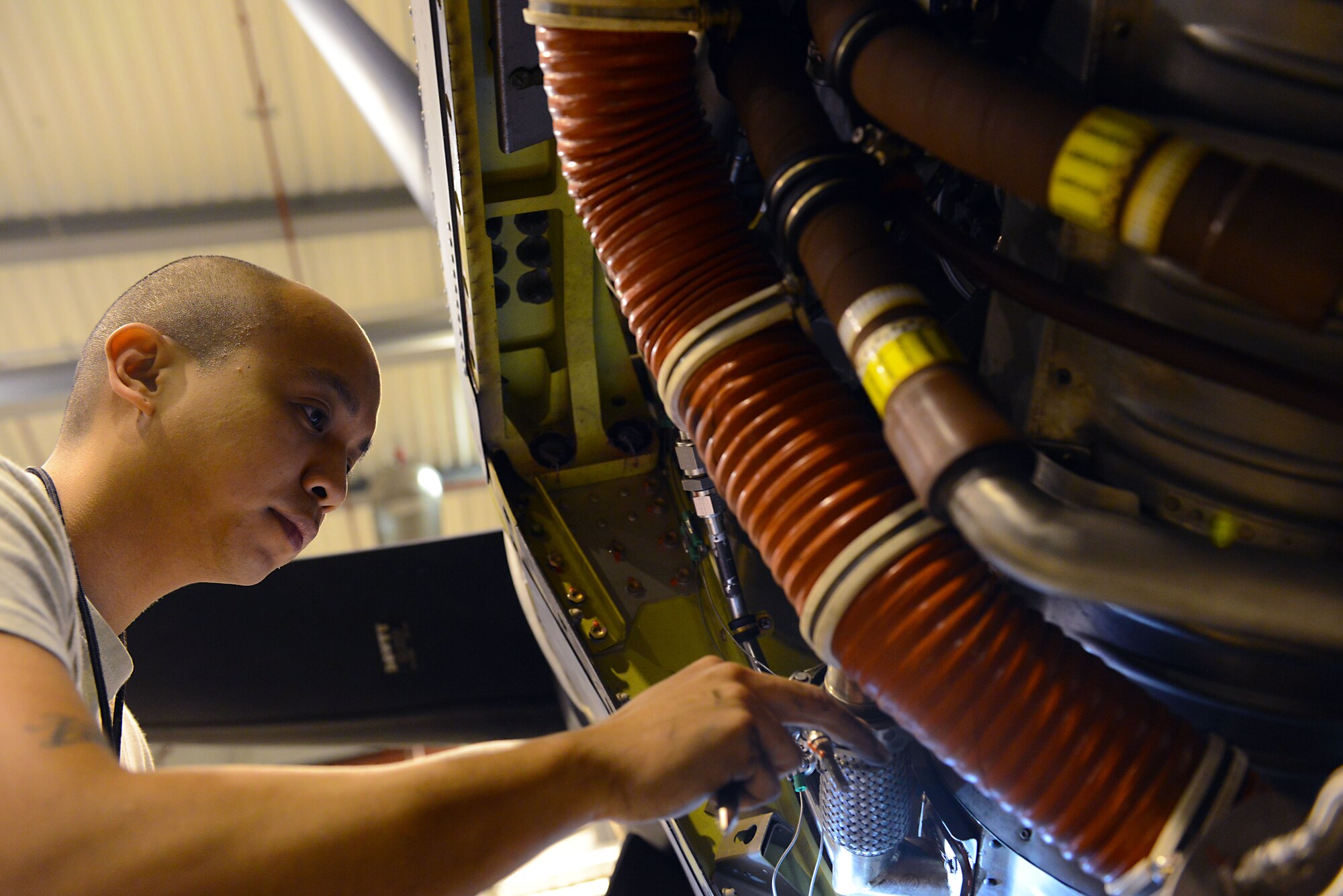 Staff Sgt. Jonathan Deguzman, 86th Maintenance Squadron aerospace propulsion journeyman, inspects an engine on a C-130J Super Hercules Jan. 7, 2016, at Ramstein Air Base, Germany. Deguzman and other Airmen from the 86th MXS Isochronal (ISO) Inspection section performed a C-2 ISO inspection on the aircraft. (U.S. Air Force photo/Staff Sgt. Timothy Moore) 
