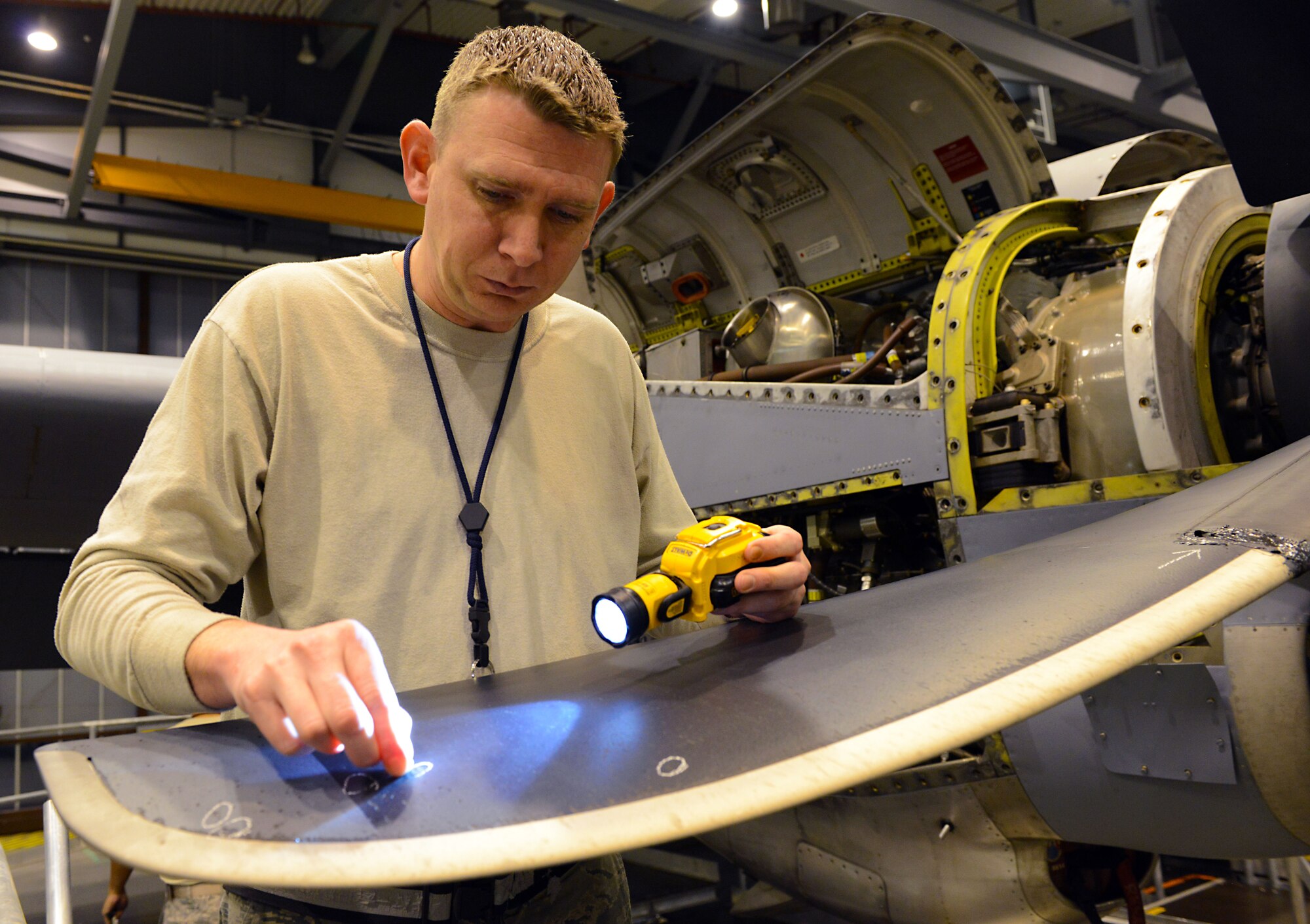 Staff Sgt. Joshua Stites, 86th Maintenance Squadron aerospace propulsion journeyman, marks damaged areas on a C-130J Super Hercules propeller Jan. 7, 2016, at Ramstein Air Base, Germany. Stites was marking damaged areas as part of a C-2 isochronal inspection of the aircraft. (U.S. Air Force photo/Staff Sgt. Timothy Moore)