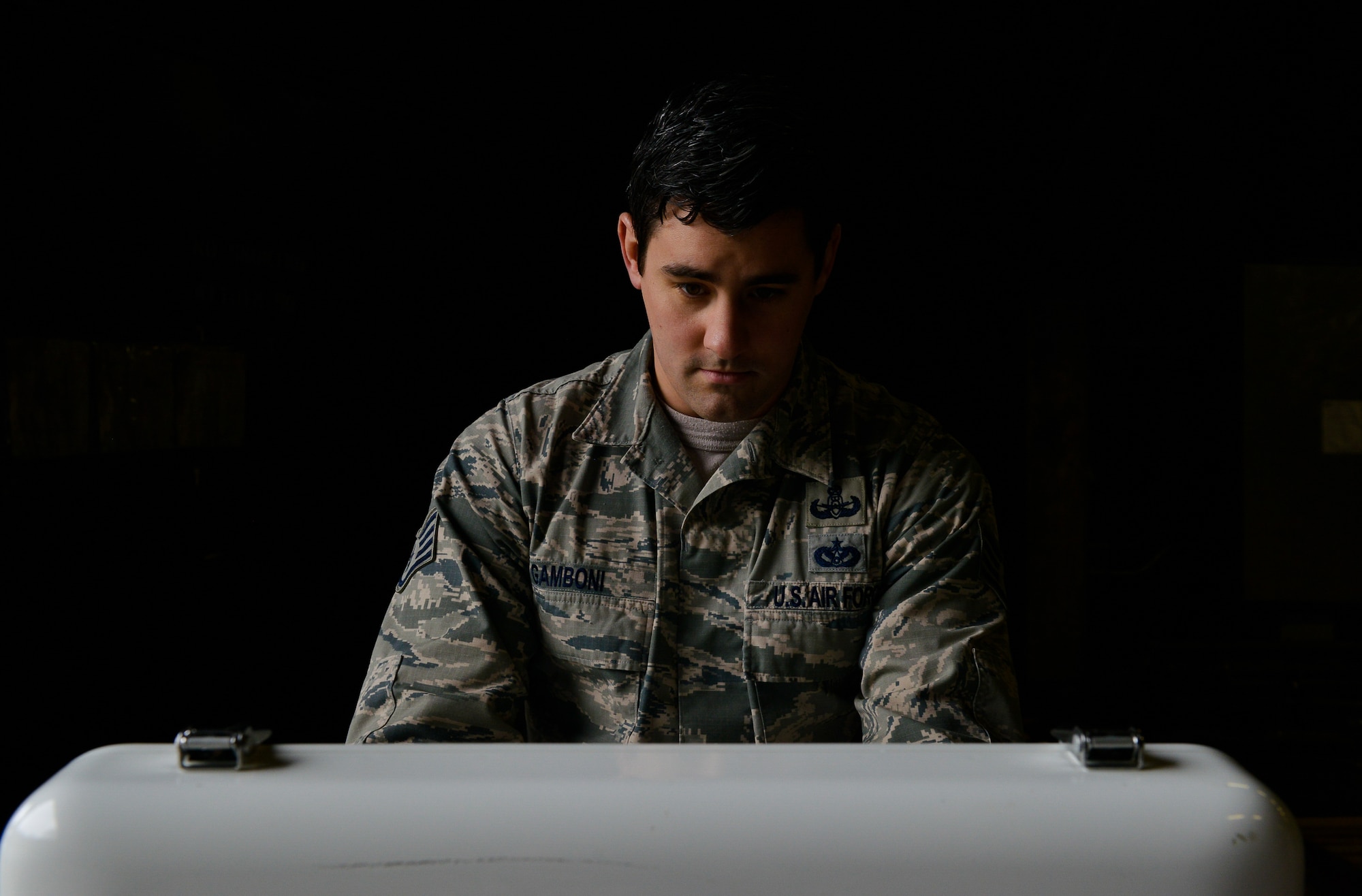 Staff Sgt. Ryan Gamboni, 786th Civil Engineer Squadron Explosive Ordnance Disposal technician, controls an All-purpose Remote Transport System through a remote computer Jan. 28, 2016, at Ramstein Air Base, Germany. Gamboni and other EOD Airmen worked with the ARTS by testing its controls as it located objects placed around the training area. (U.S. Air Force photo/Airman 1st Class Lane T. Plummer)