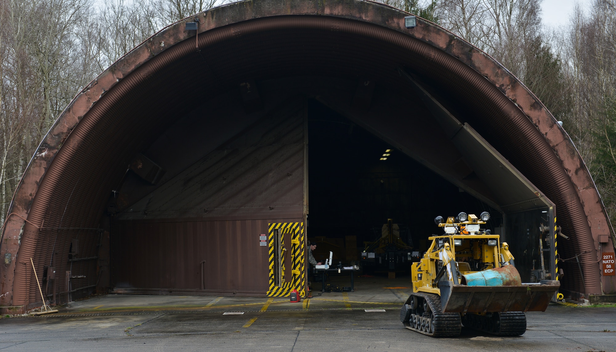Airmen from the 786th Civil Engineer Squadron Explosive Ordnance Disposal bring an All-purpose Remote Transport System back during a training event Jan. 28, 2016, at Ramstein Air Base, Germany. The training was to test the ARTS’s efficiency at maneuvering around an environment and locating key objects. (U.S. Air Force photo/Airman 1st Class Lane T. Plummer)