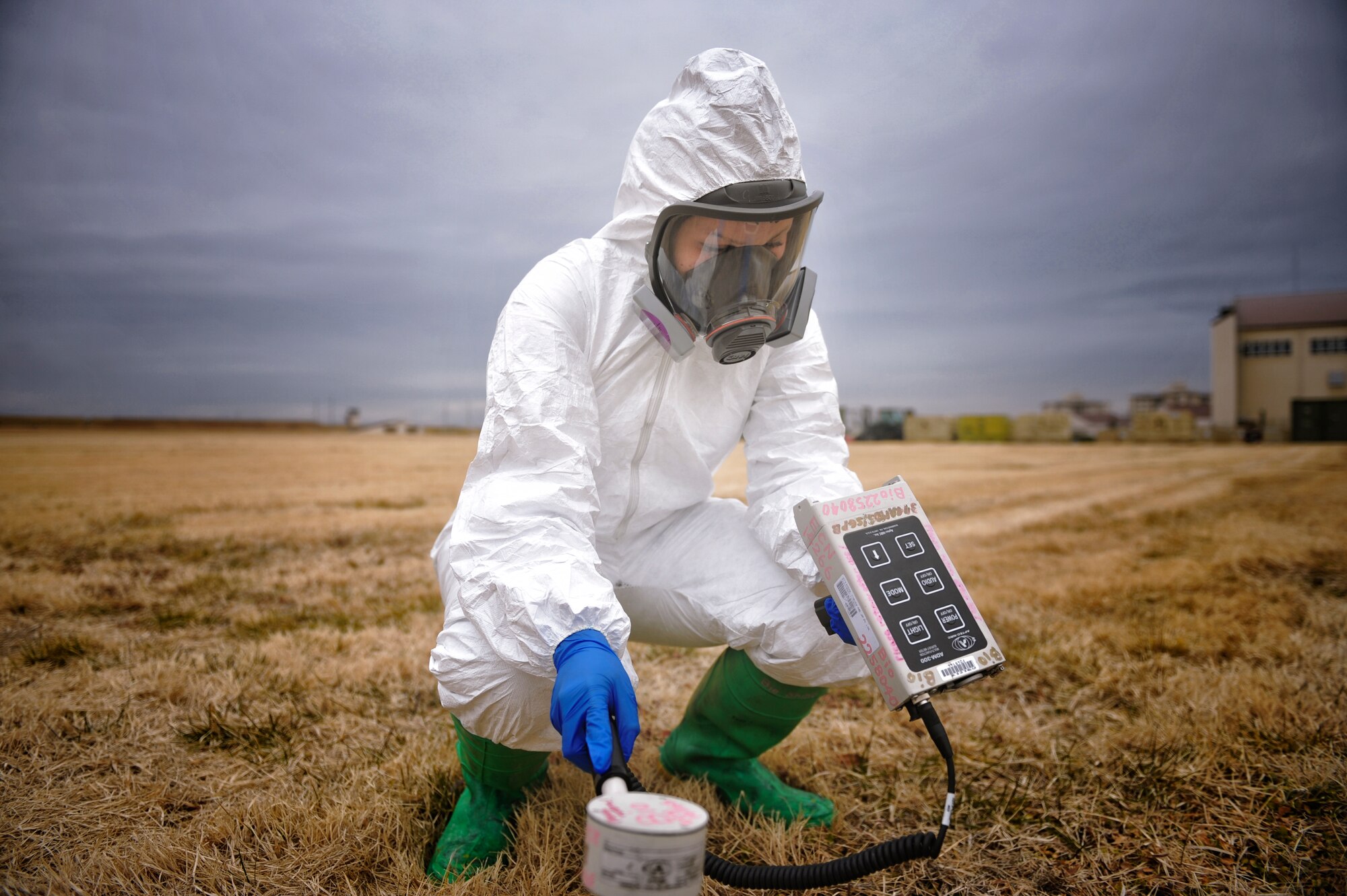 Airman Natalie Gaston, 374th Medical Support Squadron bioenvironmental technician, simulates using an ADM 300, an instrument that measures radiation in the air during emergency responses, at Yokota Air Base, Japan, Feb. 1, 2016. Bioenvironmental engineering first responders use an ADM 300 to protect them from possible contamination while taking samples. (U.S. Air Force photo by Airman 1st Class Delano Scott/Released)