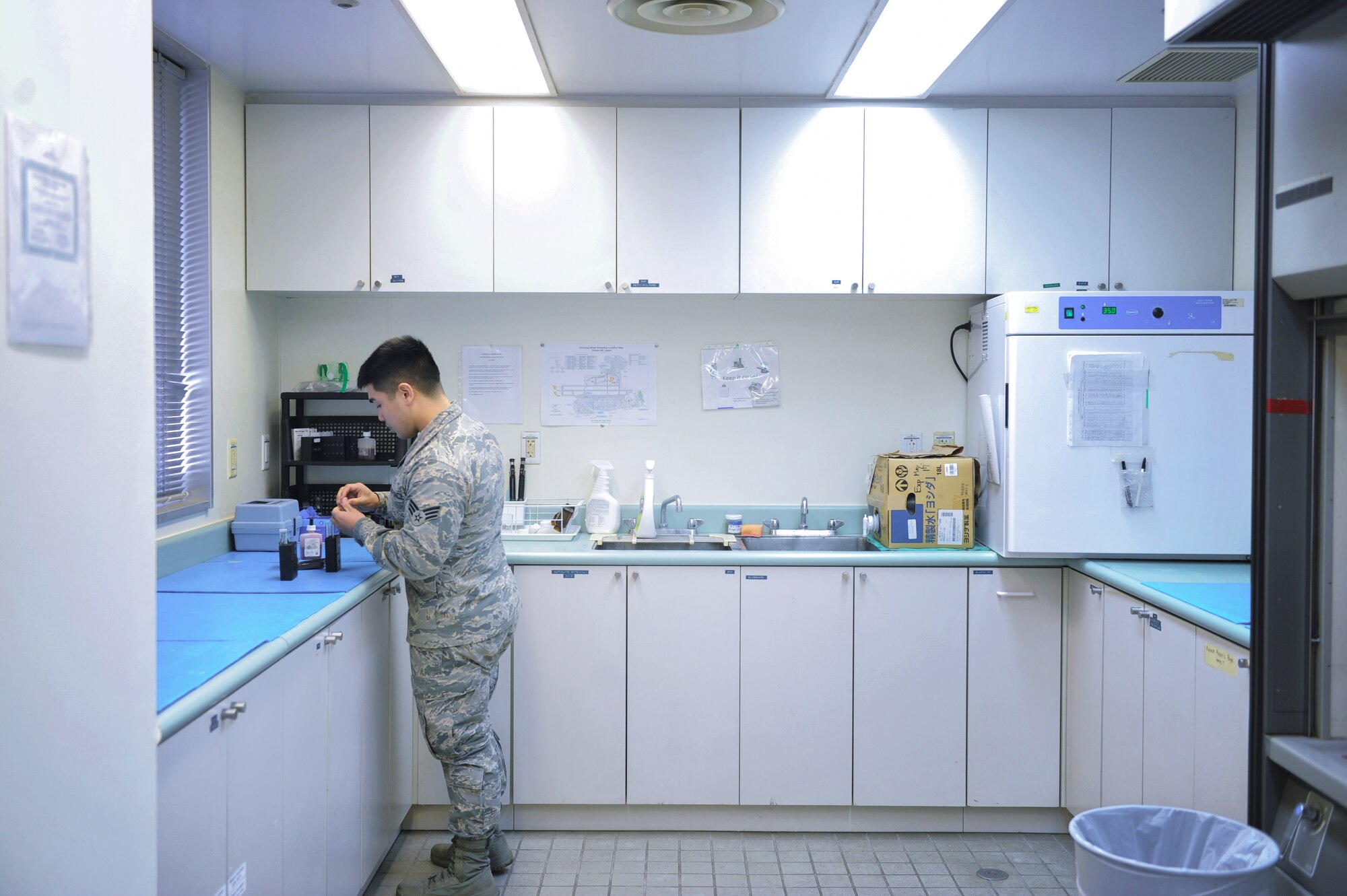 Senior Airman Julian Austria, 374th Medical Support Squadron bioenvironmental technician, tests water samples at Yokota Air Base, Japan, Jan. 27, 2016. From routine examinations of Yokota’s water sources to conducting environmental health assessments for workplaces, the bioenvironmental engineering flight works to protect base personnel from potential hazards one can come across in a military environment. (U.S. Air Force photo by Airman 1st Class Delano Scott/Released)