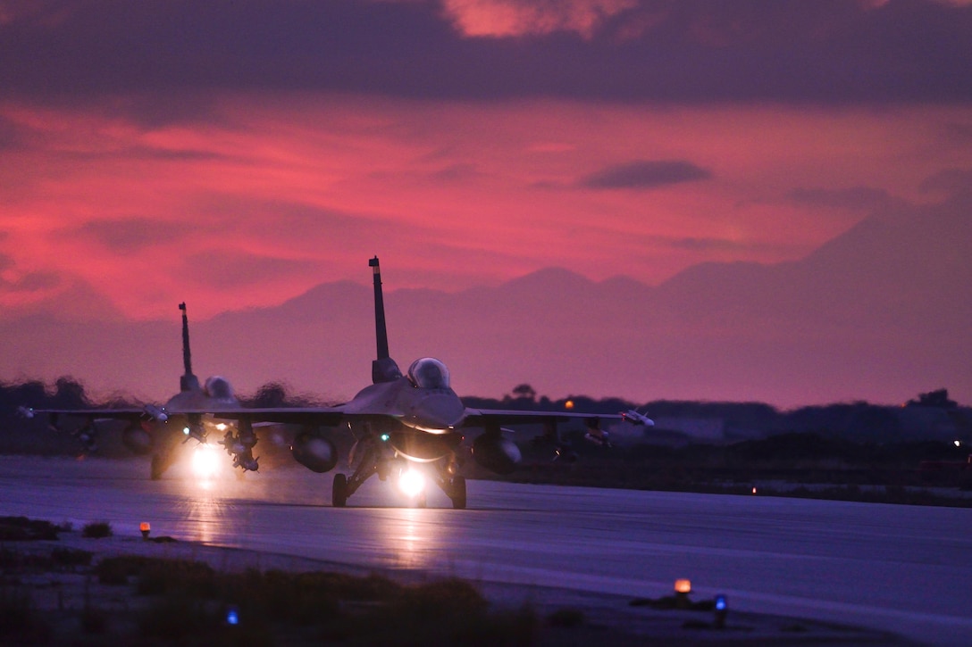 Air Force pilots taxi in F-16 Fighting Falcon aircraft on the flightline at Souda Bay, Greece, Jan. 28, 2016. The pilots, assigned to the 480th Expeditionary Fighter Squadron, are conducting a flying training deployment. Air Force photo by Staff Sgt. Christopher Ruano