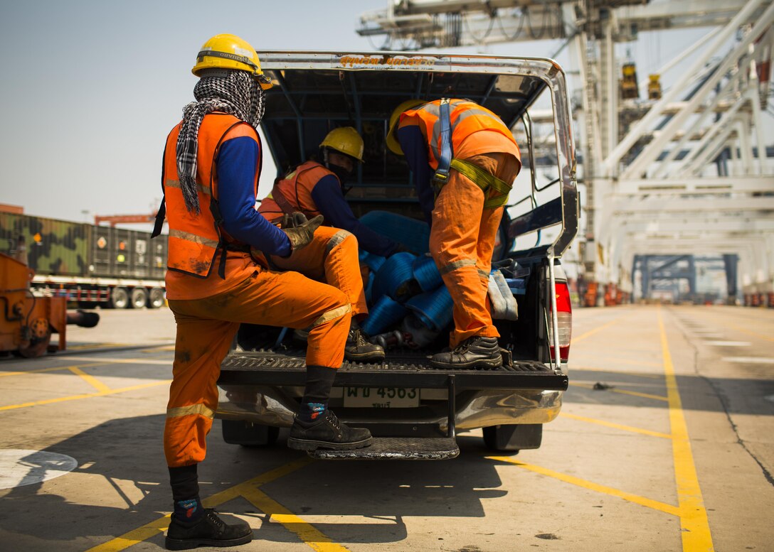 Dock hands at Laem Chabang International Terminal unload straps used to offload supply containers from the USNS Maj. Stephen W. Pless, in Chon Buri, Thailand, Jan. 27, 2016. Cobra Gold, in its 35th iteration, is an important element of the United States' and all other participating nations' regional military to military engagement efforts.