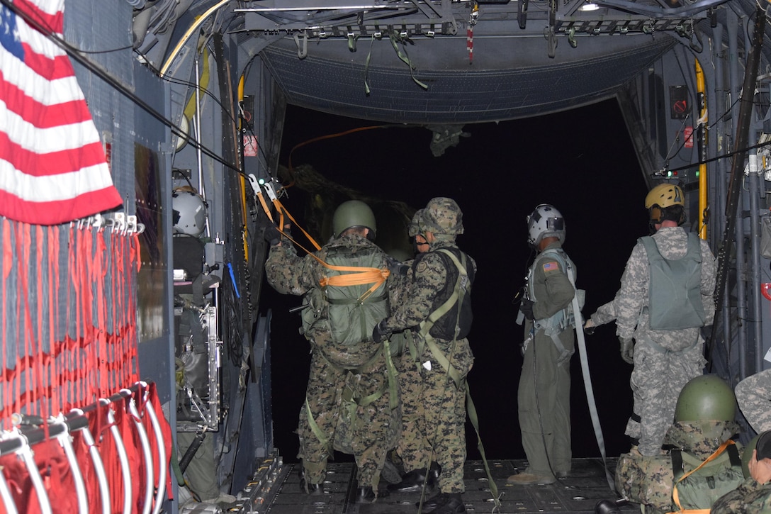 U.S. and Republic of Korea Special Operations Forces conduct night airborne operations off the ramp of a MC-130J Commando II.  Airmen from the 353rd Special Operations Group stationed out of Kadena Air Base, Japan routinely fly aircraft and crews to support Special Operations Command Korea’s annual combined readiness exercises.  (SOCKOR photo/Released) 