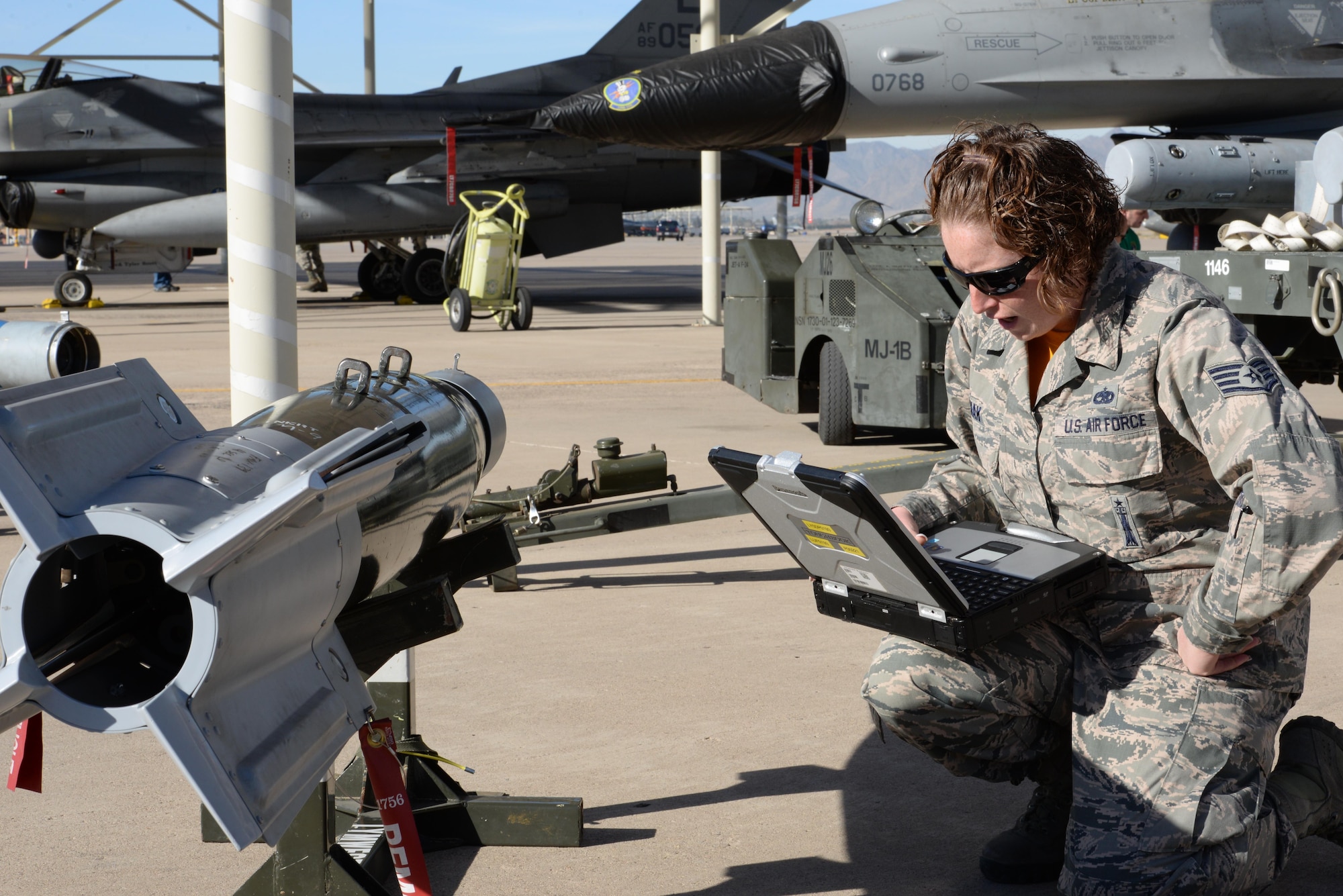 Staff Sgt. Amy Zmak, 61st Aircraft Maintenance Unit load crew member, prepares munitions for loading onto an F-35 Lightning II during the annual competition. 