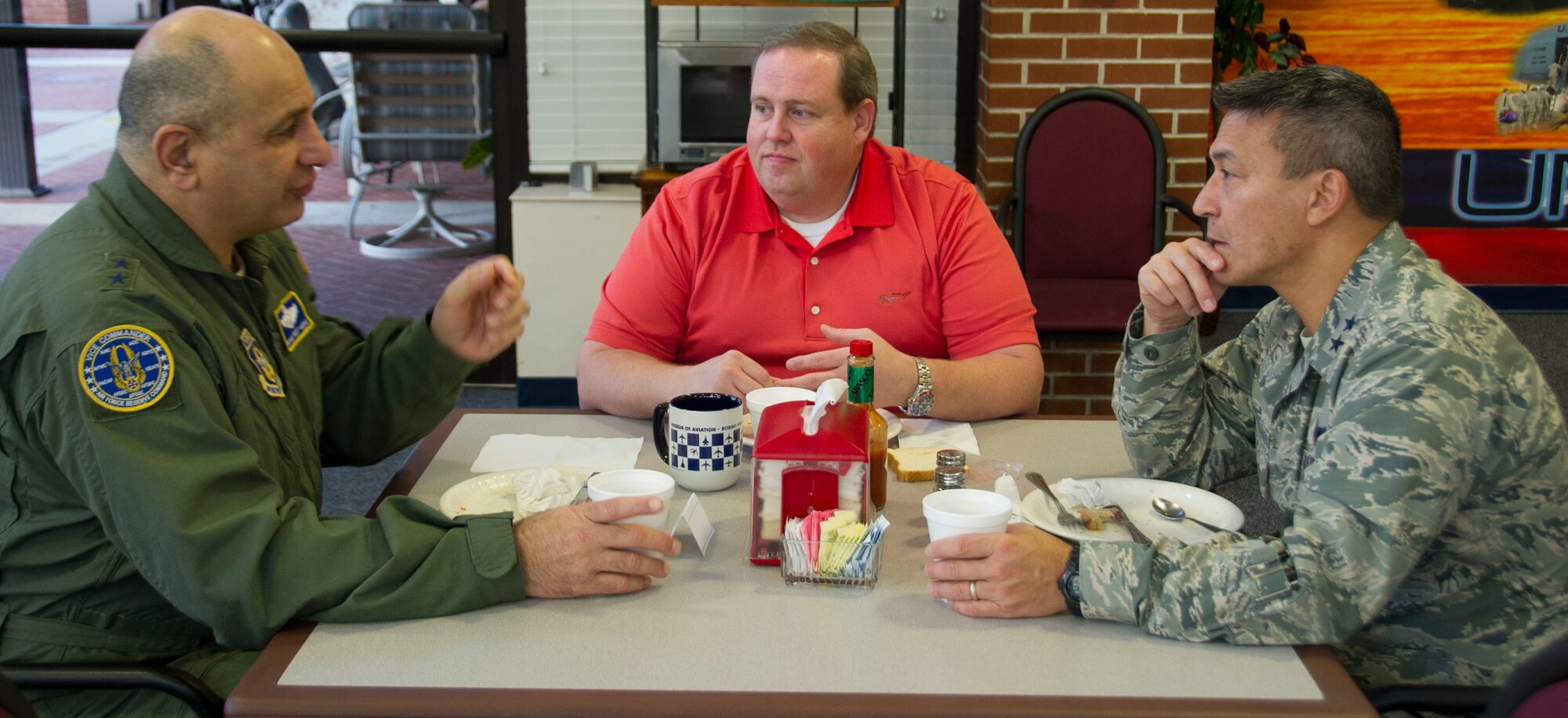 Maj. Gen. Richard "Beef" Haddad, vice commander, Air Force Reserve Command, and Maj. Gen. Michael Kim, mobilization assistant, Air Force Reserve Command, have breakfast with Jay Taylor, AFRC's honorary commander at the Wynn Dining Facility at Robins Air Force Base, Ga, Feb 2, 2016. The Honorary Commanders Program encourages an exchange of ideas and experiences from the civilian community. Additionally, The program is a method to foster a supportive relationship between the base and the community, increase military involvement in civic endeavors and organizations plus make the members of our local community part of our family. (U.S. Air Force photo by Steven French)