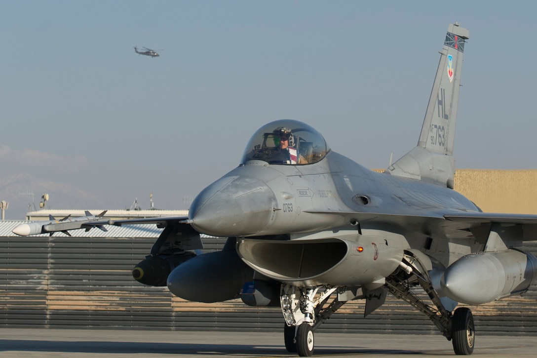 Air Force Capt. Brad Hunt taxis to the runway in an F-16 Fighting Falcon aircraft on Bagram Airfield, Afghanistan, Feb. 1, 2016. Hunt is a pilot assigned to the 421st Expeditionary Fighter Squadron. Air Force photo by Tech. Sgt. Robert Cloys
