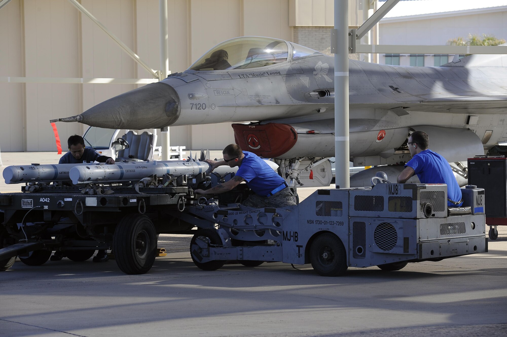 The 309th Aircraft Maintenance Unit load crew load their next weapon Jan. 29, 2016 at Luke Air Force Base, Ariz. Teams compete, under the scrutiny of experienced judges, to complete the loading of several weapons on their aircraft within a 35-minute time limit. 