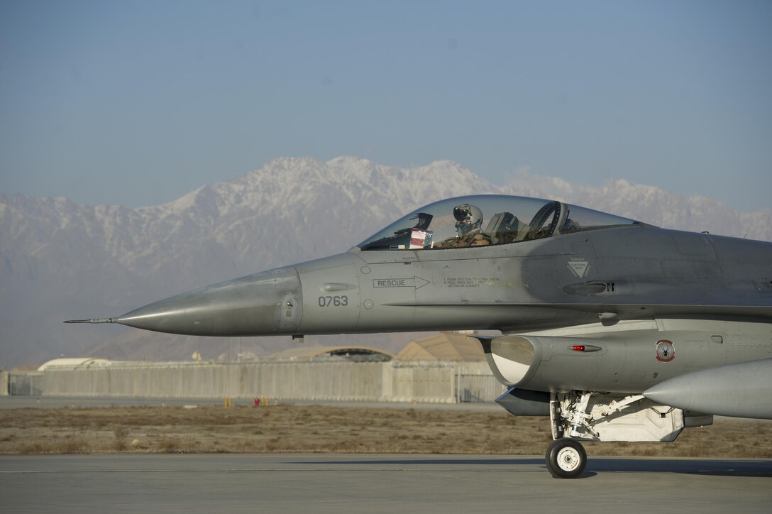 Air Force Capt. Brad Hunt taxis to the runway in an F-16 Fighting Falcon aircraft on Bagram Airfield, Afghanistan, Feb. 1, 2016. Hunt is a pilot assigned to the 421st Expeditionary Fighter Squadron. Air Force photo by Tech. Sgt. Robert Cloys