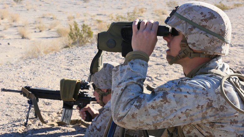 Pfc. Landon Heger, rifleman, 3rd Battalion, 7th Marine Regiment, spots targets for Pfc. Conner Price, rifleman, 3/7, during the Designated Marksman Course’s culminating event at Range 113, Jan. 28, 2016. More than 10 ‘Cutting Edge’ and ‘Darkside’ Marines in shooter-spotter teams participated in the three-week course utilizing the M27 Infantry Automatic Rifle. 
