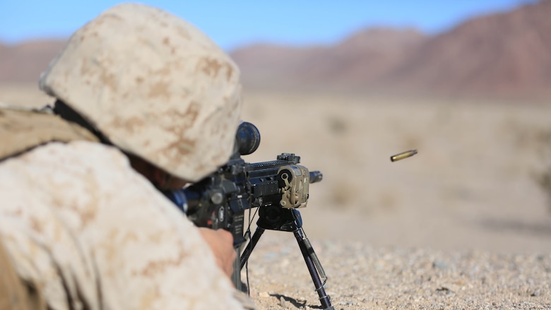 Lance Cpl. Colton Rine, rifleman, 3rd Battalion, 4th Marines, 7th Marine Regiment, fires his M27 Infantry Automatic Rifle, during the Designated Marksman Course’s culminating event at Range 113, Jan. 28, 2016. 