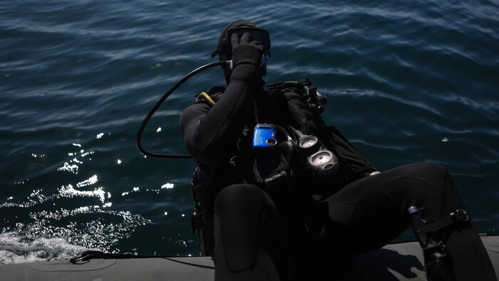 Captain Scott Williams, company commander of Company A, 1st Reconnaissance Battalion, 1st Marine Division, dives out of a rigid-hulled inflatable boat to conduct underwater search operations training off the coast of California, Jan. 28, 2016. The Marines and Sailors of Co. A will use their dive ability to give the 11th Marine Expeditionary Unit a valuable underwater search tool when it deploys later this year.