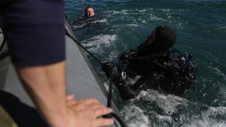 Marines with Company A, 1st Reconnaissance Battalion, 1st Marine Division, surface and prepare to board a rigid-hulled inflatable boat after conducting underwater search operations training off the coast of California, Jan. 28, 2016. The Marines and Sailors will use their dive ability to give the 11th Marine Expeditionary Unit a valuable underwater search tool when it deploys later this year.