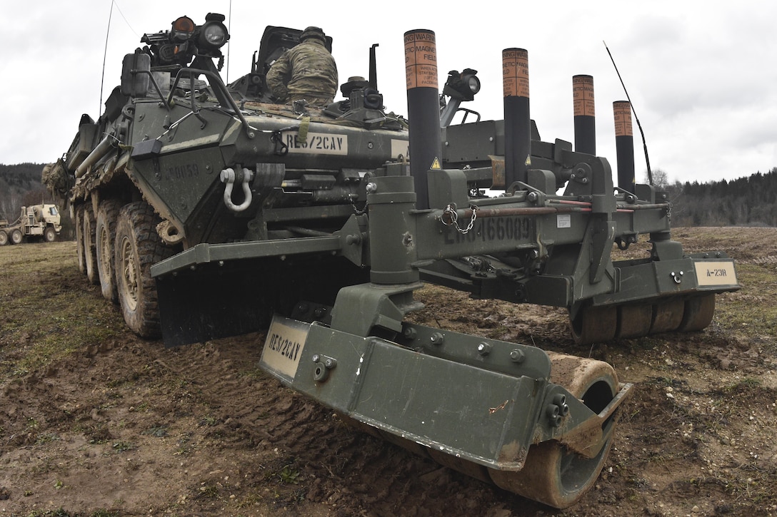 Soldiers conduct maintenance and general upkeep of their engineer vehicles while awaiting orders for their next mission during the unit's participation in Allied Spirit IV in Hohenfels, Germany, Jan. 28, 2016. Army photo by Sgt. William A. Tanner