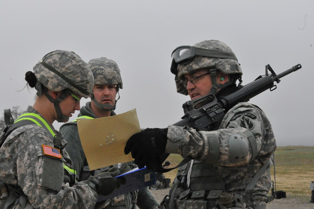 U.S. Army Reserve Sgt. 1st Class Brian Williams (right) participates in unit field training dressed in full combat gear. Crediting military training and vigilance, Williams reported a man acting suspiciously taking pictures of Levi Stadium (home of Super Bowl 50) with what appeared to be a small camera and some sort of transmission device. Stadium authorities detained the man and confirmed Williams’ suspicions, stating the FBI and Homeland Security officials were holding the man for further questioning. (Photo courtesy of Sgt. 1st Class Brian Williams)