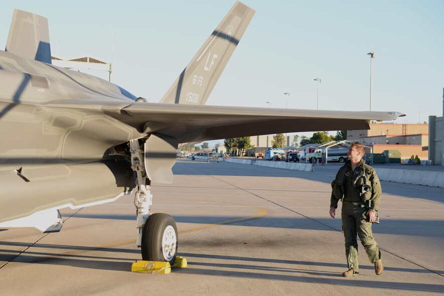 Lt. Col. Matthew Hayden, the 56th Fighter Wing chief of safety and pilot attached to the 61st Fighter Squadron, inspects his F-35 Lightning II before entering the cockpit and beginning takeoff procedures Feb. 2, 2016, at Luke Air Force Base, Ariz. Hayden became the first Luke AFB pilot to achieve 500 flight hours in an F-35. (U.S. Air Force photo/Airman 1st Class Ridge Shan)