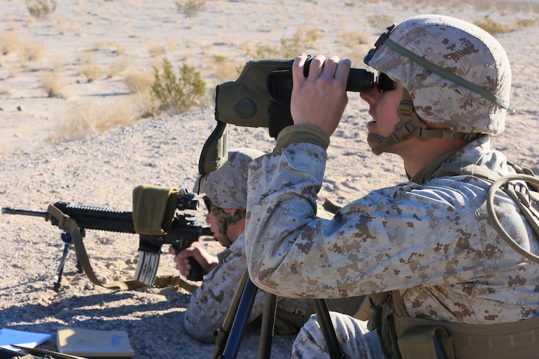 Pfc. Landon Heger, rifleman, 3rd Battalion, 7th Marine Regiment, spots targets for Pfc. Conner Price, rifleman, 3/7, during the Designated Marksman Course’s culminating event at Range 113, Jan. 28, 2016. More than 10 ‘Cutting Edge’ and ‘Darkside’ Marines in shooter-spotter teams participated in the three-week course utilizing the M27 Infantry Automatic Rifle. (Official Marine Corps photo by Cpl. Julio McGraw/Released)