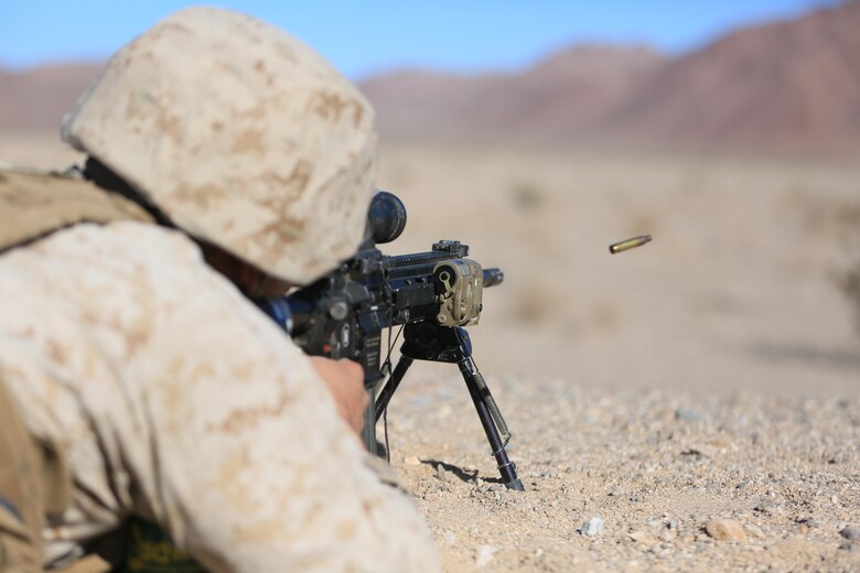 Lance Cpl. Colton Rine, rifleman, 3rd Battalion, 4th Marines, 7th Marine Regiment, fires his M27 Infantry Automatic Rifle, during the Designated Marksman Course’s culminating event at Range 113, Jan. 28, 2016. (Official Marine Corps Photo by Cpl. Julio McGraw/Released)