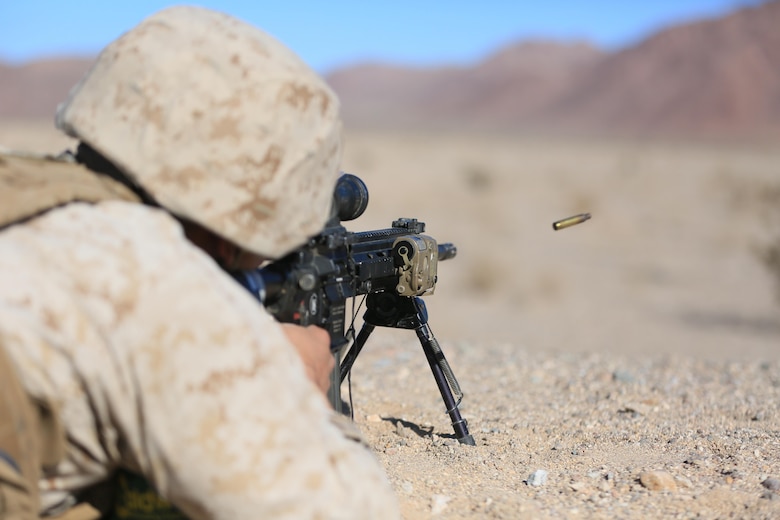 Lance Cpl. Colton Rine, rifleman, 3rd Battalion, 4th Marines, 7th Marine Regiment, fires his M27 Infantry Automatic Rifle, during the Designated Marksman Course’s culminating event at Range 113, Jan. 28, 2016. (Official Marine Corps Photo by Cpl. Julio McGraw/Released)