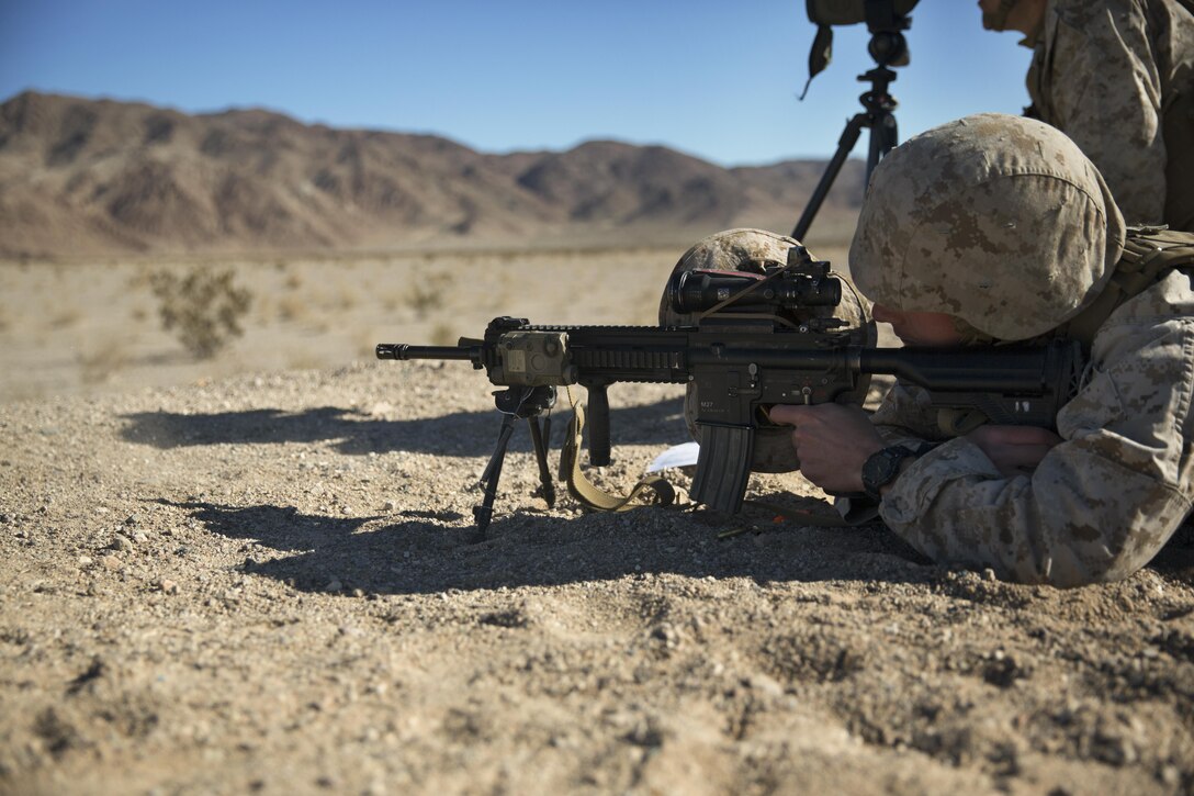 Corporal Jared Ingerson, rifleman, 3rd Battalion, 4th Marines, 7th Marine Regiment, fires his M27 Infantry Automatic Rifle at a target during the Designated Marksman Course’s culminating event at Range 113, Jan. 28, 2016. (Official Marine Corps photo by Lance Cpl. Levi Schultz/Released)