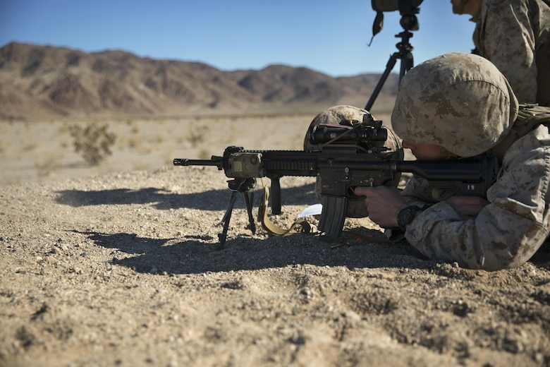 Corporal Jared Ingerson, rifleman, 3rd Battalion, 4th Marines, 7th Marine Regiment, fires his M27 Infantry Automatic Rifle at a target during the Designated Marksman Course’s culminating event at Range 113, Jan. 28, 2016. (Official Marine Corps photo by Lance Cpl. Levi Schultz/Released)