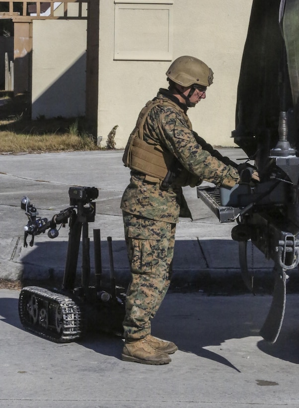 A Marine with Explosive Ordnance Disposal Company, 8th Engineer Support Battalion, establishes control of the MK-2 Mod 1 Talon, a device used to acquire visuals of an improvised explosive device during an IED access training exercise at Camp Lejeune, N.C., Jan. 29, 2016. During the exercise, evaluators assessed Marines on safely locating and disposing of an IED while suppressing the full capabilities of the threat. (U.S. Marine Corps photo by Lance Cpl. Aaron K. Fiala/Released)