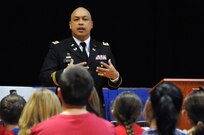 Lt. Col. Julian R. Nierva, deputy staff judge advocate for the U.S. Army Reserve's 99th Regional Support Command headquartered at Joint Base McGuire-Dix-Lakehurst, N.J., speaks to children Feb. 3 at the Immaculate Conception Elementary School in Spotswood, N.J., during the school's Patriotic Day.