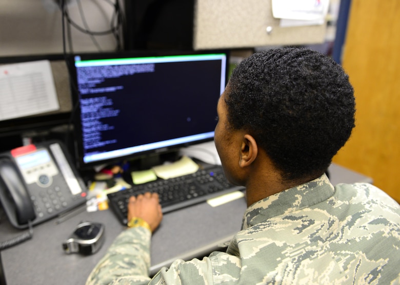 U.S. Air Force Airman 1st Class Angelo Dickerson, 354th Communications Squadron cyber transport systems technician, works on the computer Jan. 27, 2016, at Eielson Air Force Base, Alaska. Dickerson has remote access through the computer to troubleshoot computer connectivity issues across Eielson. (U.S. Air Force photo by Airman 1st Class Cassandra Whitman/Released)