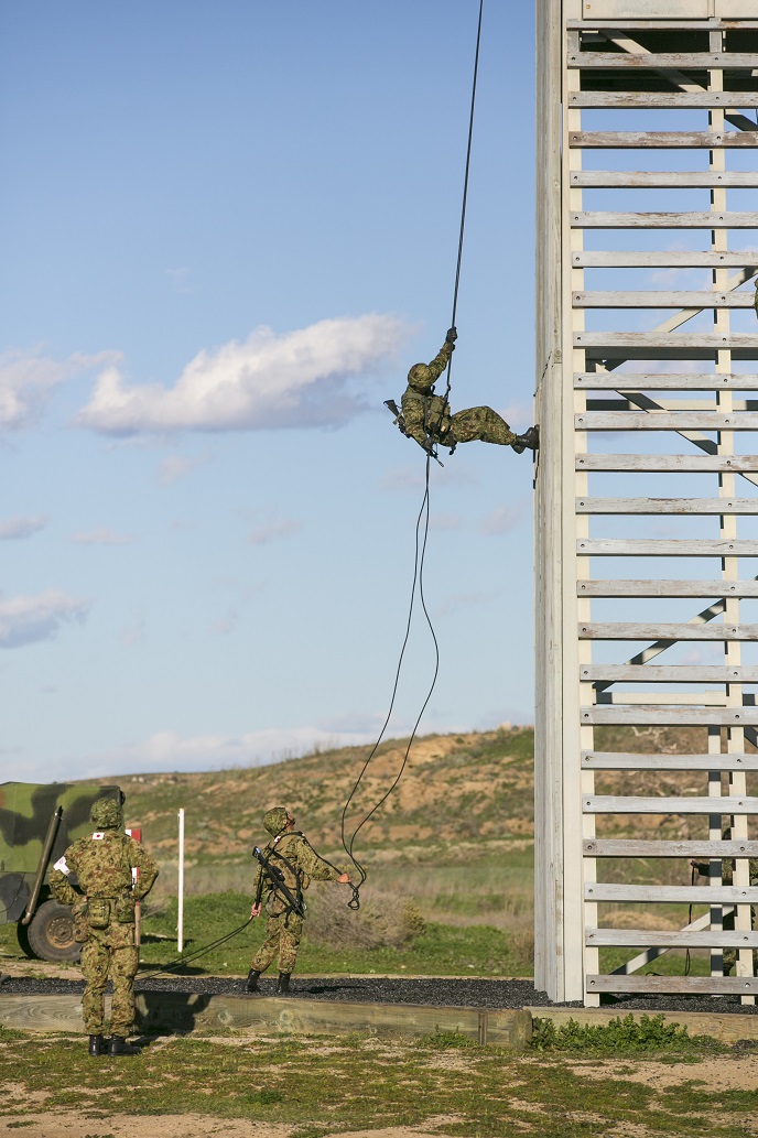 A Japan Ground Self-Defense Force (JGSDF) soldier rappels down a tower during helicopter rope suspension training, during Exercise Iron Fist 2016 aboard Camp Pendleton, Calif., Feb. 1, 2016. Rappelling is a controlled descent from a great height using a harness and ropes as a pulley system. (U.S. Marine Corps photo by Cpl. Xzavior T. McNeal/Released)