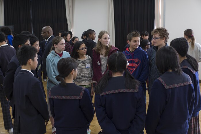 Students from Matthew C. Perry Junior High School from Marine Corps Air Station Iwakuni, Japan, and Takamori Midori Junior High School gather in groups for an introductory activity during a cultural exchange event at Midori Junior High in Kuga, Feb. 2, 2016. The students played word games designed to bolster their confidence in using their English or Japanese vocabulary. Cultural exchanges like this help foster relationships with Japan as the air station continues to grow.