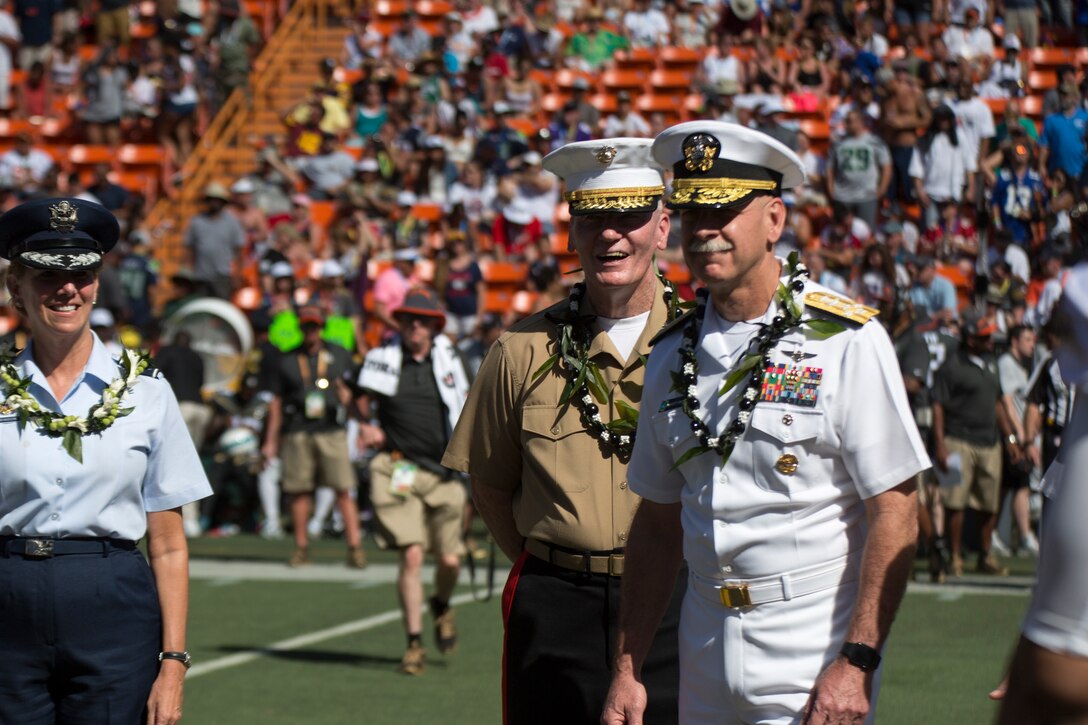 (From left) Lt. Gen. John A. Toolan, commander, U.S. Marine Corps Forces, Pacific and Adm. Scott Swift, commander, U.S. Pacific Fleet enjoy a laugh prior to the coin toss of the 2016 NFL Pro Bowl, at Aloha Stadium in Honolulu, Hawaii, Jan. 31, 2016. This year marks the 35th Pro Bowl held at Aloha Stadium, and commanders from each component command were present for the coin toss. 