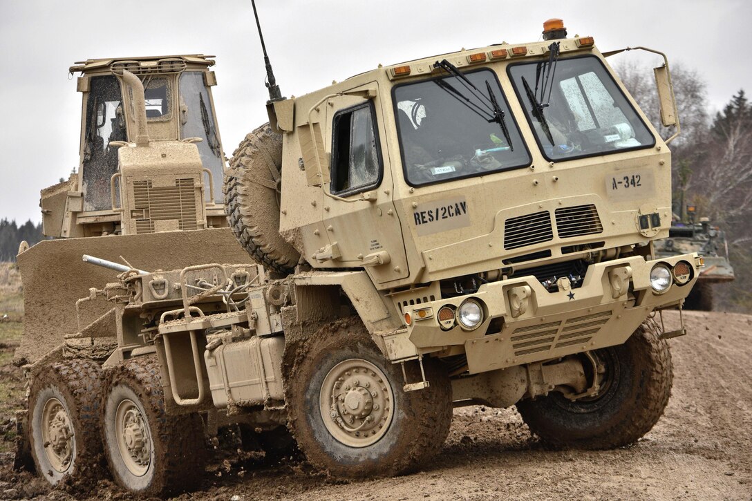 Soldiers drive their vehicle and equipment through the mud toward the tactical fuel point while conducting maintenance operations and general upkeep of their vehicles during the unit's participation in Allied Spirit IV in Hohenfels, Germany, Jan. 28, 2016. Army photo by Sgt. William A. Tanner