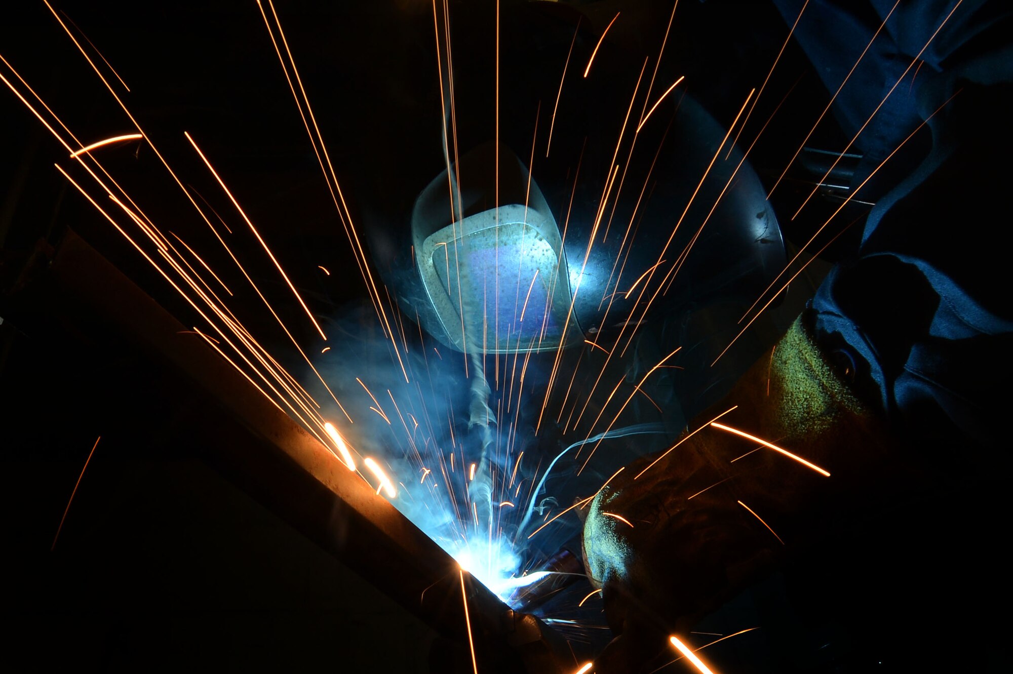 U.S. Air Force Senior Airman John Abbott, 20th Equipment Maintenance Squadron metals technology journeyman, welds a piece of metal at Shaw Air Force Base, S.C., Feb. 2, 2016. The 20th EMS metals technology flight uses their welding skillset to support the 76 F-16CM Fighting Falcons assigned to the 20th Fighter Wing. (U.S. Air Force photo by Senior Airman Michael Cossaboom)