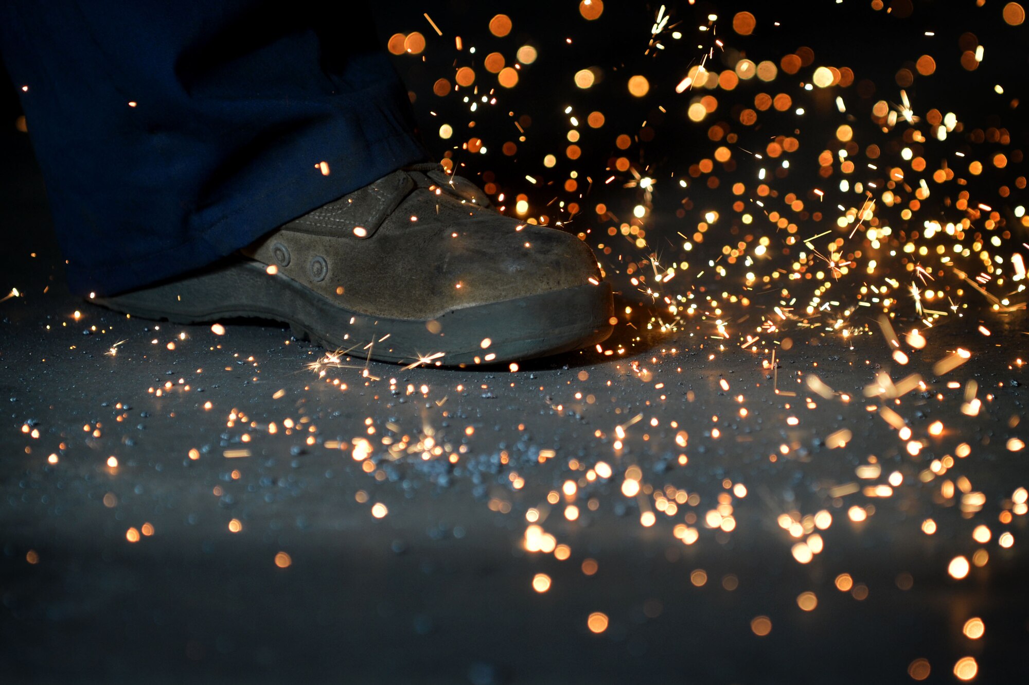 U.S. Air Force Senior Airman John Abbott, 20th Equipment Maintenance Squadron metals technology journeyman, welds a piece of metal as sparks fly around him at Shaw Air Force Base, S.C., Feb. 2, 2016. The 20th EMS metals technology flight uses their welding skillset to support the 76 F-16CM Fighting Falcons assigned to the 20th Fighter Wing. (U.S. Air Force photo by Senior Airman Michael Cossaboom)
