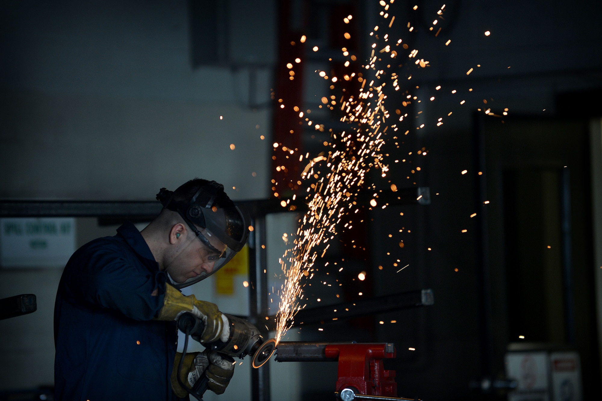 U.S. Air Force Senior Airman John Abbott, 20th Equipment Maintenance Squadron metals technology journeyman, grinds a piece of metal at Shaw Air Force Base, S.C., Feb. 2, 2016. The metals technology shop is notoriously the last stop for broken parts with the motto: “if we can’t fix it, no one can.” (U.S. Air Force photo by Senior Airman Michael Cossaboom)
