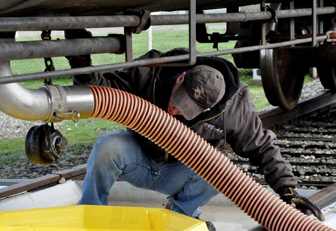Stan Rought, a liquid fuels technician contractor, transfers jet fuel from the Beale train to the installation Bulk Storage Plant Jan. 20, 2016, at Beale  Air Force Base, California. The train program primarily supports the U-2 Dragon Lady and processes jet fuel from Texas to ensure continuity of the flying mission. (U.S. Air Force photo by Staff Sgt. Jeffrey M.  Schultze)