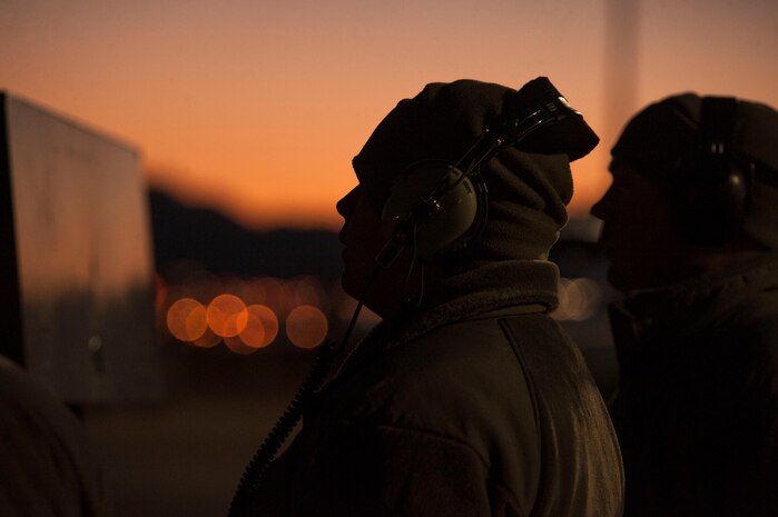 A crew chief  assigned to the 169th Aircraft Maintenance Squadron, McEntire Joint National Guard Base, S.C.,  communicates with another maintainer in the cockpit of an F-16 Fighting Falcon during Red Flag 16-1 at Nellis AFB, Nev., Feb. 2. Maintainers are responsible for and dedicated to overseeing the day-to-day maintenance of aircraft participating in the three-week exercise. (U.S. Air Force photo by Airman 1st Class Rachel Loftis)