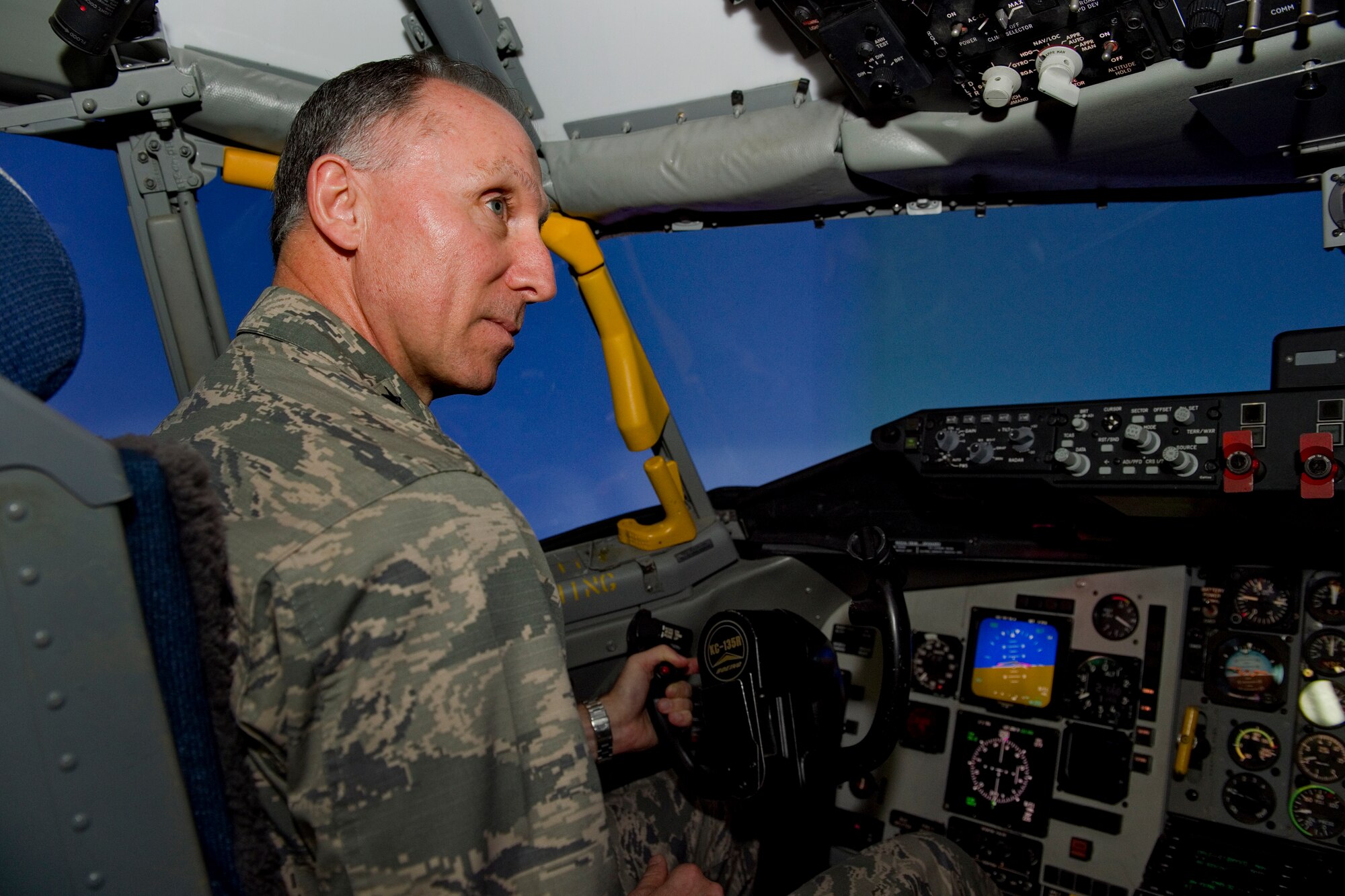 Lt. Gen. Bill Bender, Air Force chief of information dominance and chief information officer, operates the controls of a KC-135R Stratotanker simulator during his visit to Grissom Air Reserve Base, Ind., Jan. 14, 2016. During his visit, he learned first-hand the mission and capabilities of the Hoosier Wing. (U.S. Air Force photo/Tech. Sgt. Benjamin Mota)