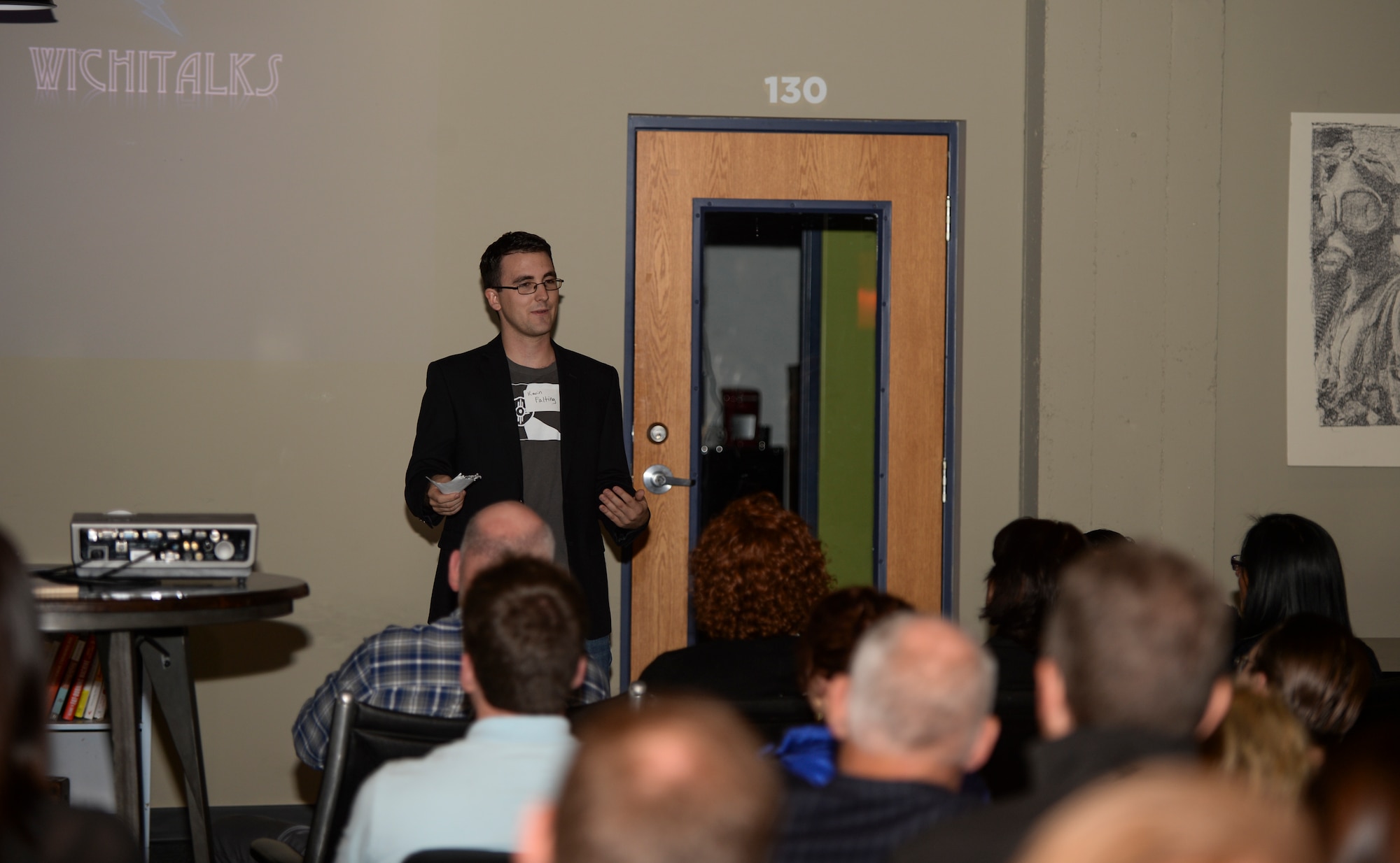 Senior Airman Kevin Falting, 22nd Aircraft Maintenance Squadron crewchief, speaks to a group of entrepreneurs during ‘Wichitalks’, Jan. 29, 2016, at The Labor Party in Wichita, Kan. Wichitalks is a TED Talk style grouping, where different people from around the community discuss and share ideas on how to make the community and city a better place to live. This was the first ever session. (U.S. Air Force photo/Senior Airman Colby L. Hardin)